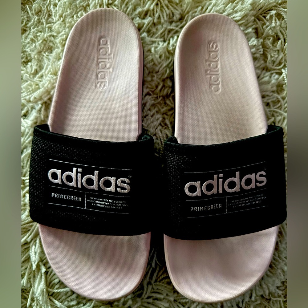 Pink and black Adidas slides